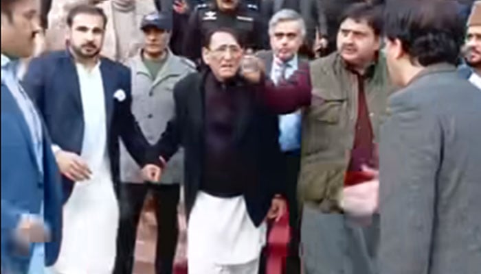 The image shows Punjab Assembly Speaker Malik Muhammad Ahmad Khan seeing off renowned religious and spiritual scholar Professor Ahmed Rafique Akhtar after the event on Dec 26, 2024. — Screengrab via Facebook/Jam Sattar