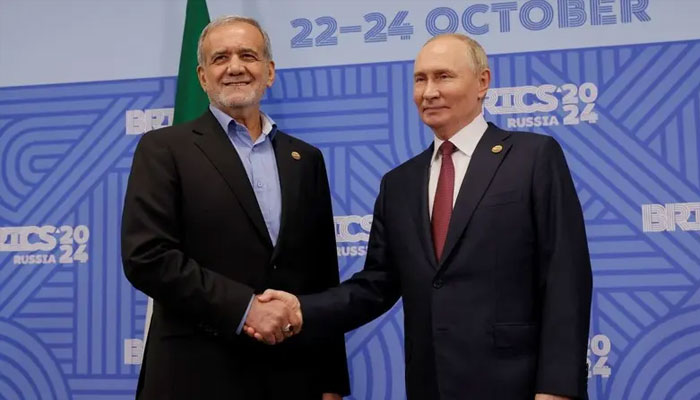 Russian President Vladimir Putin shakes hands with Iranian President Masoud Pezeshkian during a meeting on the sidelines of the BRICS summit in Kazan, Russia, October 23, 2024.— Reuters
