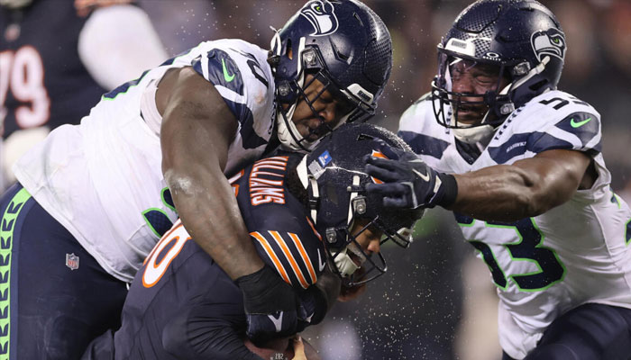 Seattles Jarran Reed, (left) sacks Chicago quarterback Caleb Williams in a defense-dominated 6-3 NFL victory over the Bears.— AFP