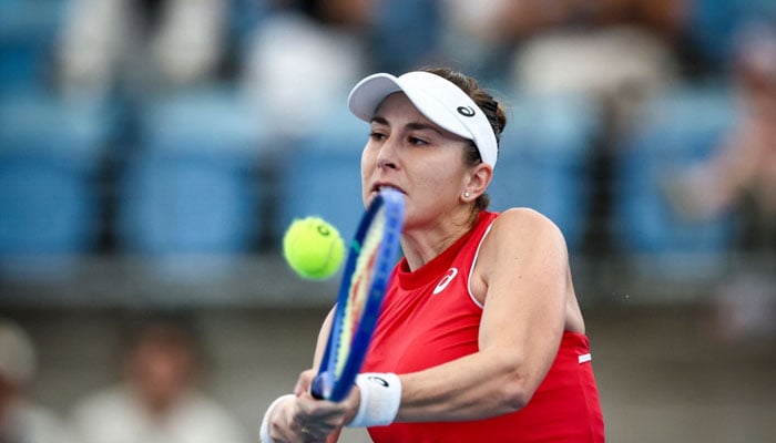 Switzerlands Belinda Bencic hits a return to Frances Chloe Paquet during their womens singles match at the United Cup tennis tournament on Ken Rosewall Arena in Sydney on December 28, 2024. —AFP