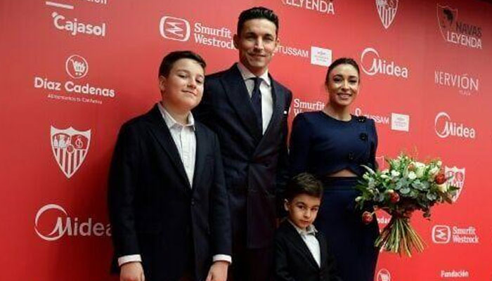 Sevillas Spanish defender Jesus Navas and family during his farewell ceremony. — AFP/File