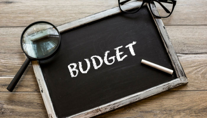 A representational image of budget written with chalk on a miniature black board. — Canva/File