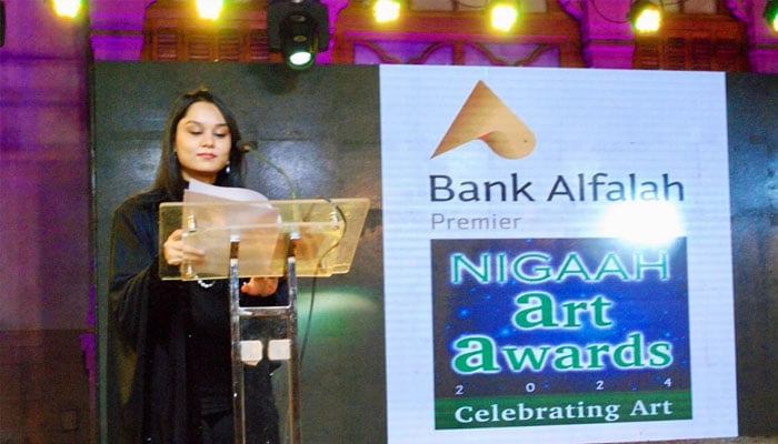 Host seen at the stage at Bank Al Falah Nigaah Art Awards 2024.— Facebook@ShanzaySubzwariArt/File