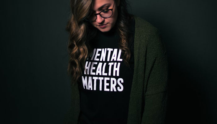 The representational image shows a woman wearing a jersey on which Mental Health Matters is written. — Unsplash/File