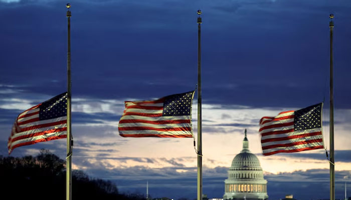 With the US Capitol in the distance, flags fly at half-staff at the Washington Monument on the National Mall following the death of former US President Jimmy Carter, in Washington, US, December 30, 2024. — Reuters