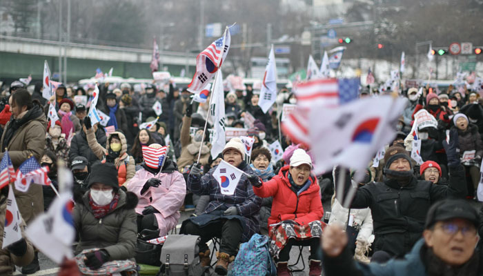 Supporters of impeached President Yoon Suk Yeol gathered near his residence, despite bitter snow conditions blanketing the capital. —AFP/File