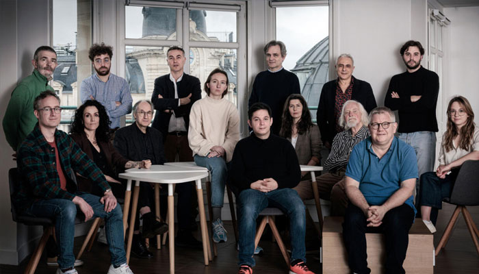 The team behind the Charlie Hebdo satirical newspaper pose during a photo session in Paris in March 2024. —AFP/File