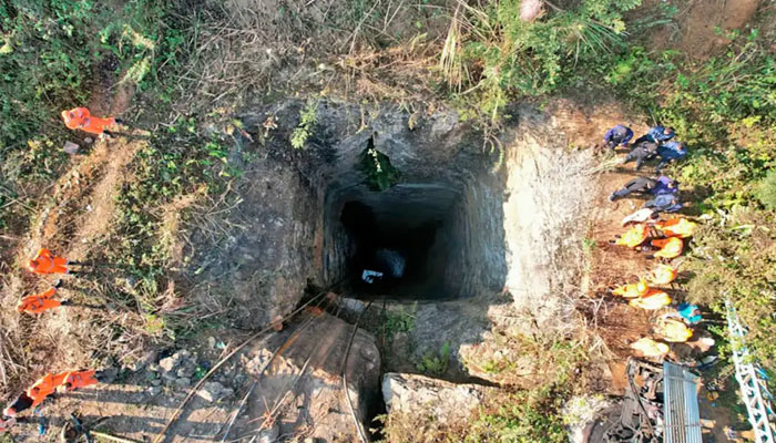 Rescuers and soldiers are working to reach the trapped men. — AFP/File