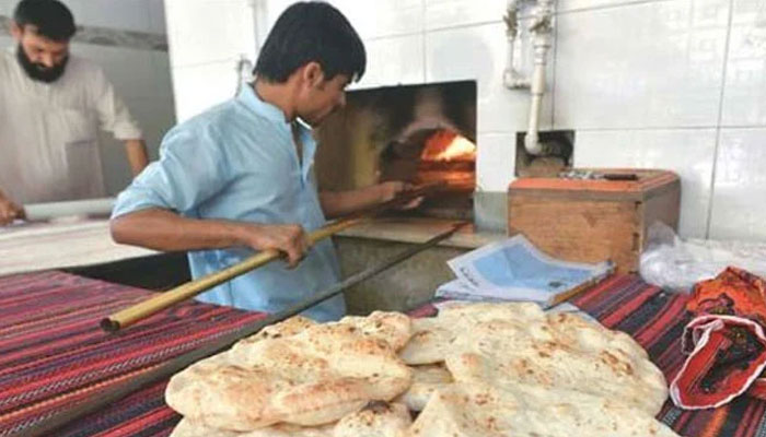 This representational image shows a naanbai making bread in shop. — The News/File