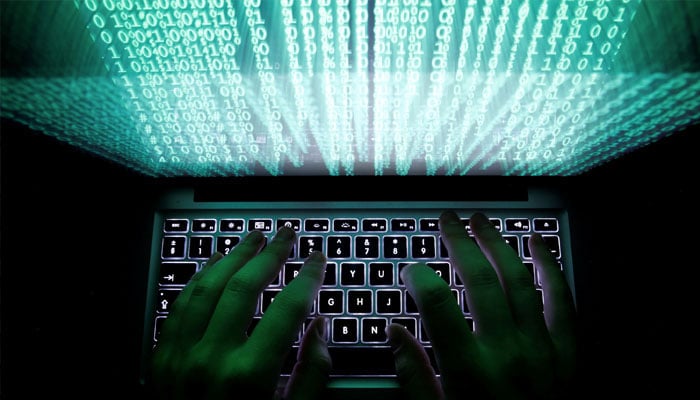 A man types on a computer keyboard in this illustration picture taken February 28, 2013. — Reuters