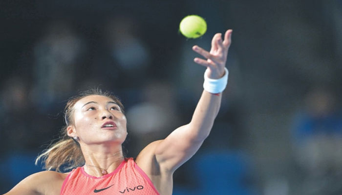 Chinas Olympic champion Zheng Qinwen serves to Leylah Fernandez of Canada during their Pan Pacific Open quarter-final on Friday.—AFP