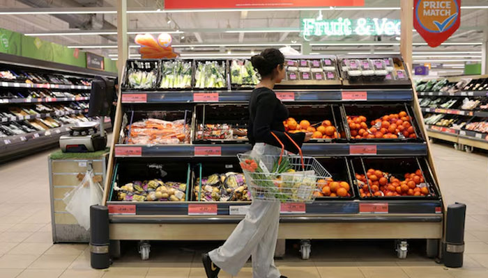 A customer shops in the fruit aisle inside a Sainsbury’s supermarket, in Richmond, West London, Britain February 21, 2024. — Reuters