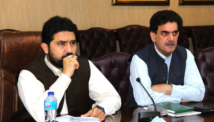 Special Assistant to Chief Minister on Communications and Works Sohail Afridi (left) seen amid a meeting.— Facebook@CWDKPGovt/File