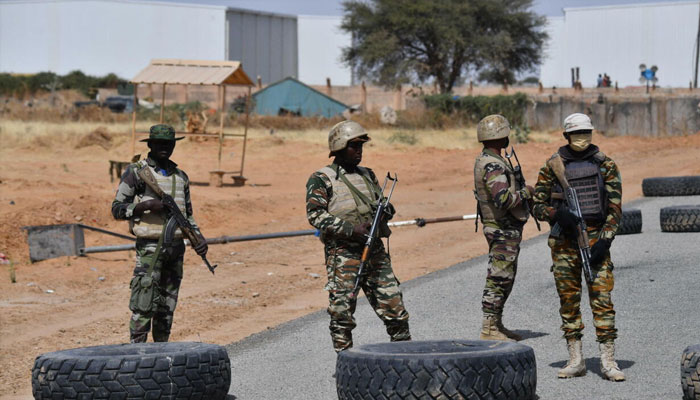Nigerien soldiers stand guard outside Diffa airport in south-east Niger, near the Nigerian border, in December 2020. — AFP