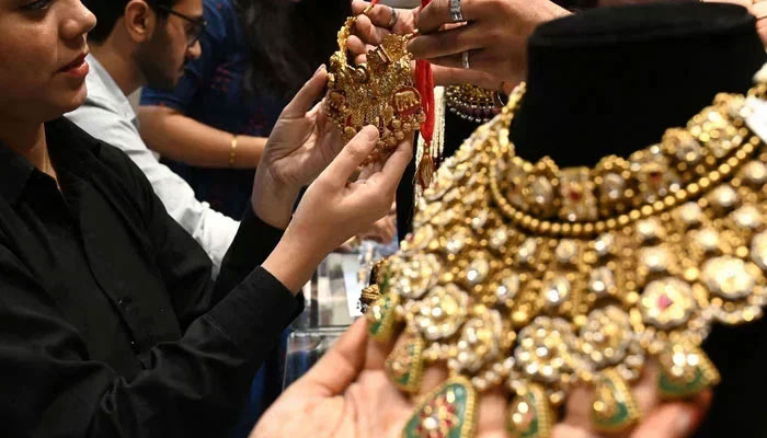People buying jewellery at a jewellery shop. — AFP/File