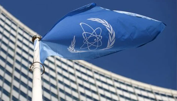 A flag with the logo of the International Atomic Energy Agency (IAEA) waves in front of the IAEA headquarters. — Reuters