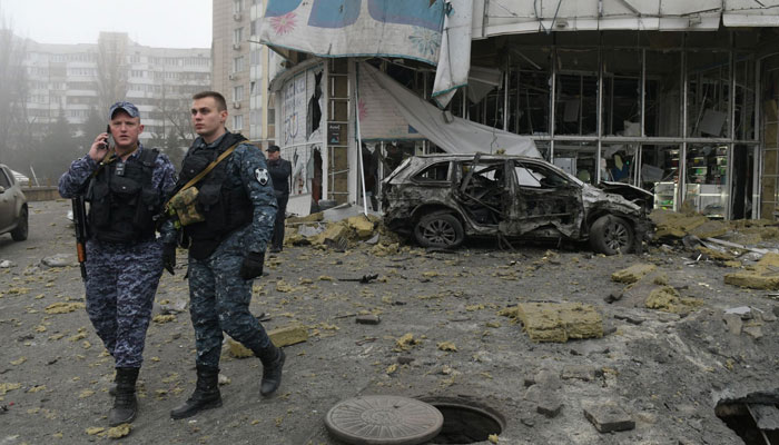 Law enforcement officers walk near a damaged store following shelling, which local officials called a Ukrainian military strike, in Donetsk, Russian-controlled Ukraine, on January 10, 2025, amid the ongoing Russian-Ukrainian conflict. — AFP