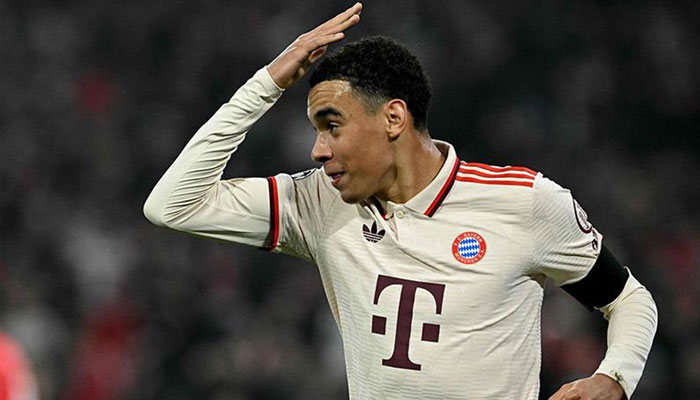 Bayern Munich’s German midfielder Jamal Musiala celebrates after scoring the 1-0 opening goal during the UEFA Champions League football match FC Bayern Munich vs SL Benfica in Munich, southern Germany. —AFP/File