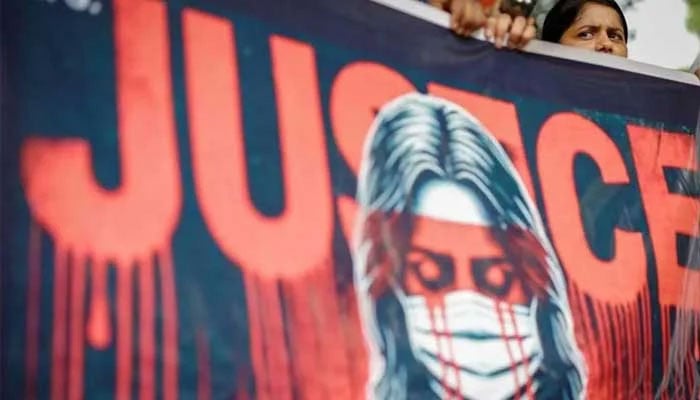 A representational image showing justice written on a poster during a protest against harassment. — Reuters/File