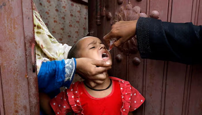 A girl receives polio vaccine drops, during an anti-polio campaign in Karachi, Pakistan July 20, 2020. — Reuters