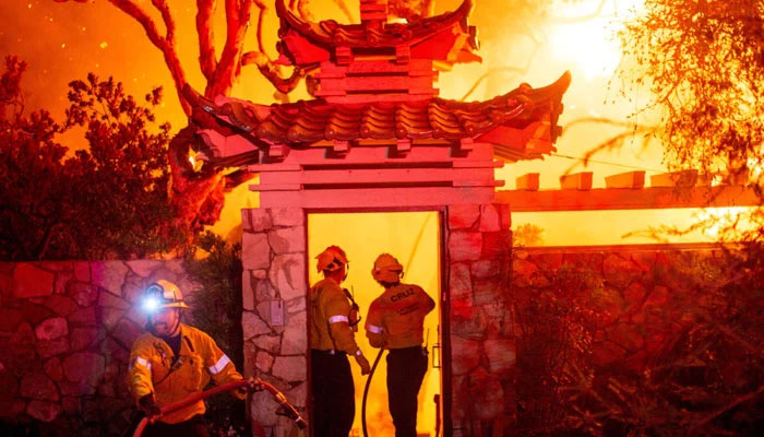Firefighters battle the Palisades Fire as it burns during a windstorm on the west side of Los Angeles, California, US January 8, 2025. — Reuters