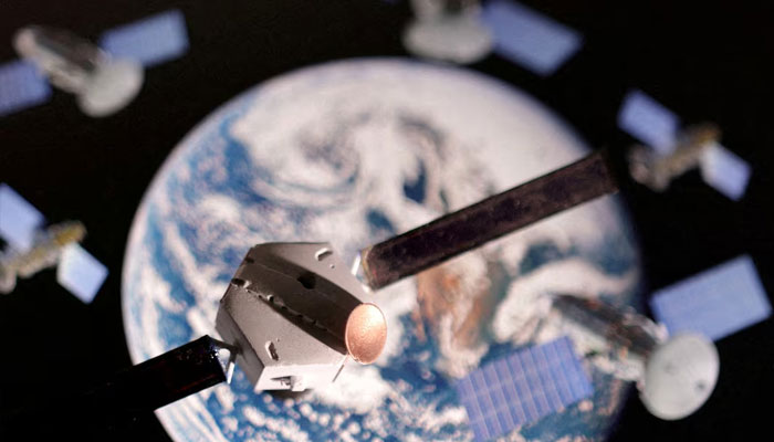 A satellite model is placed on a picture of Earth in this illustration taken November 25, 2024.— Reuters
