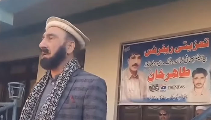 A speaker is seen addressing a condolence reference for senior journalist Tahir Khan Azikhel. — Facebook@azikhelnews/Screengrab