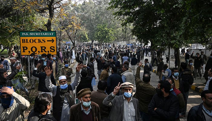 The representational image shows federal government employees marching toward the Parliament House during a protest to demand higher wages. — AFP/File