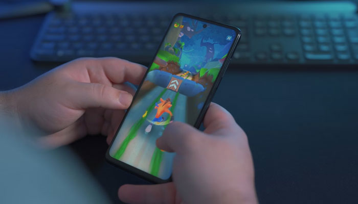 A representational image of a child playing game on a smart mobile phone. — Unsplash/File