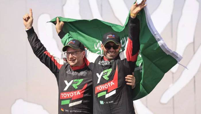 Saudi driver Yazeed Al Rajhi (right) and co-driver Edouard Boulanger celebrate after winning the Dakar Rally. — AFP/File