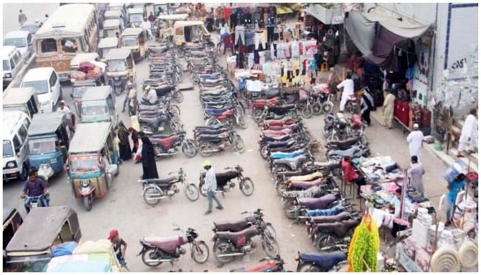 An illegal charged parking site at the Liaquatabad Supermarket. — Online/File