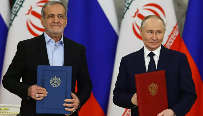Russian President Vladimir Putin (right) is pictured alongside his Iranian counterpart Masoud Pezeshkian. — AFP/File