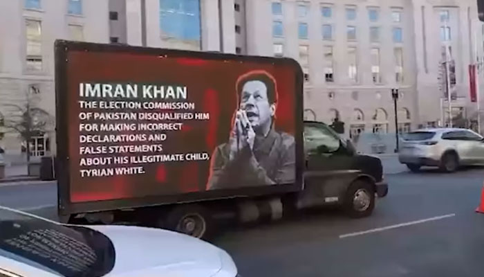 The image shows a truck with anti-PTI message in the US. — YouTube/Geo News/Screengrab