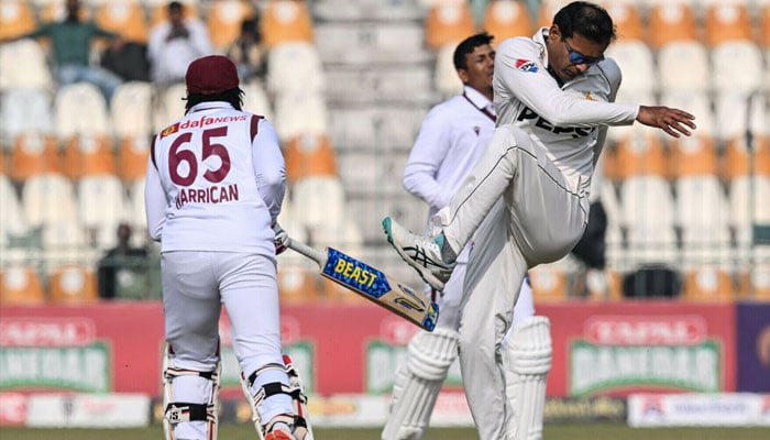Noman Ali (right) reacts during the second day of the first Test cricket match between Pakistan and West Indies at the Multan Cricket Stadium on January 18,2025. — AFP