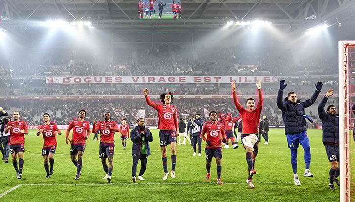 Lille´s players celebrate their victory at the end of the French L1 football match between Lille LOSC and OGC Nice at Stade Pierre-Mauroy in Villeneuve-d´Ascq, northern France on January 17, 2025. —AFP