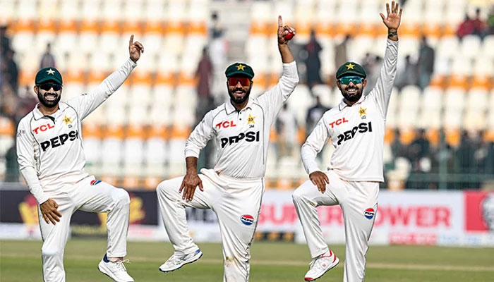 Pakistans Sajid Khan (centre) celebrates with Mohammad Rizwan (left) and Babar Azam after taking a five-wicket haul as they walk back to the pavilion after winning the first Test cricket match between Pakistan and West Indies at the Multan Cricket Stadium in Multan on January 19, 2025. — AFP