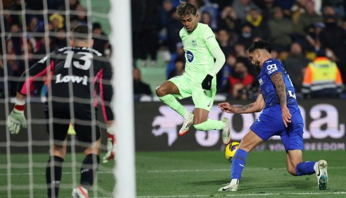 Barcelonas Jules Kounde (centre) in action. — AFP/File