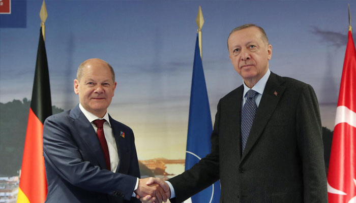Turkeys President Recep Tayyip Erdogan shakes hands with Germanys Chancellor Olaf Scholz on June 30, 2022, ahead of a NATO summit in Madrid.. —AFP
