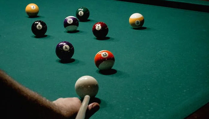 This representational image shows a person taking a shot on a snooker table.—Pexels/File