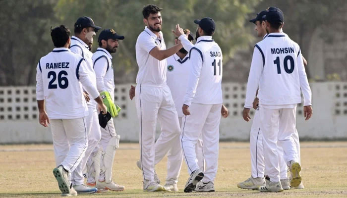 Ghani Glass players celebrate a breakthrough during the third day of the second-round match of Presidents Trophy Grade-I against Eshaal Associates in Karachi on January 16, 2025. — PCB