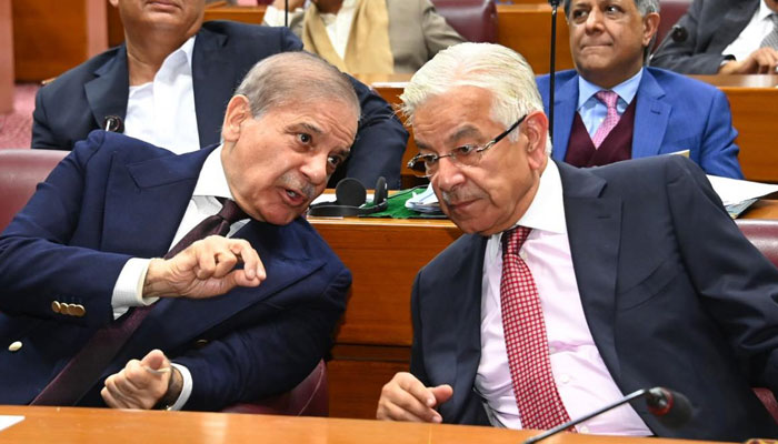 PM Shehbaz Sharif (left) interacts with Defence Minister Khawaja Asif during NA session in Islamabad on January 21, 2025. — Facebook@SardarAyazSadiq