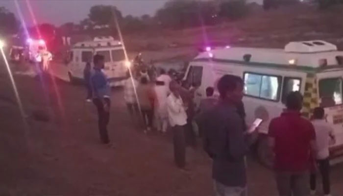 People gathered as ambulances arrive at the spot near Pachora station, where several passengers of Pushpak Express were hit by Karnataka Express on January 22, 2025. — X/@PTI_News