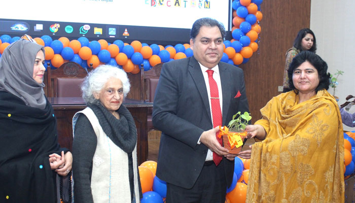 DG QAED Punjab Tajammal Abbas Rana (2nd right) distributes a plant to a teacher during the launching ceremony of the  HER-izon project at the QAED Auditorium on January 23, 2025. — Facebook@QAEDPK