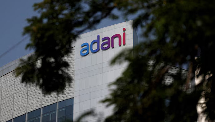 The logo of the Adani Group is seen on the facade of its Corporate House on the outskirts of Ahmedabad, India, November 21, 2024. — Reuters