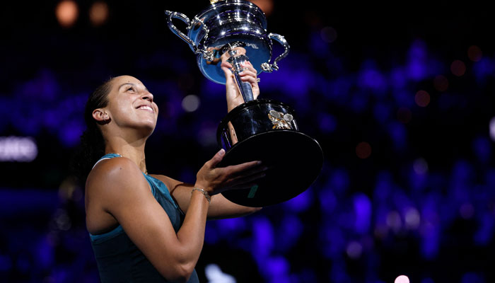 USAs Madison Keys celebrates with the Daphne Akhurst Memorial Cup after defeating Belarus Aryna Sabalenka during their women´s singles final match on day fourteen of the Australian Open tennis tournament in Melbourne on January 25, 2025. — AFP
