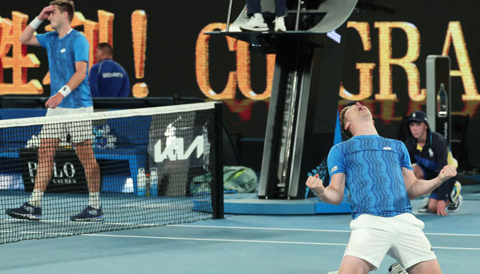 Finlands Harri Heliovaara (right) and Britain´s Henry Patten celebrate their victory against Italys Simone Bolelli and Italys Andrea Vavassori during the mens doubles final match on day fourteen of the Australian Open tennis tournament in Melbourne on January 26, 2025. — AFP