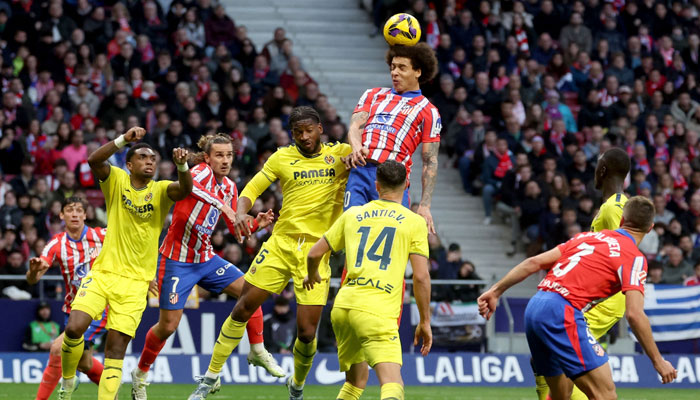 Atletico Madrids Belgian midfielder #20 Axel Witsel (C) heads the ball during the Spanish league football match between Club Atletico de Madrid and Villarreal CF at the Metropolitano stadium in Madrid on January 25, 2025. — AFP
