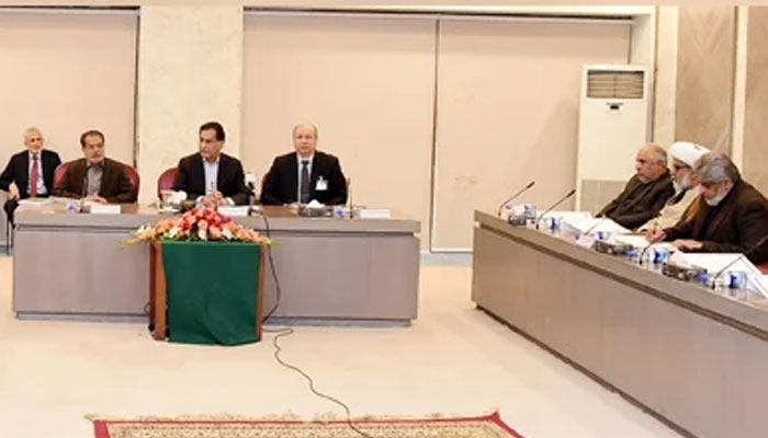 Members of the government and Pakistan Tehreek-e-Insafs (PTI) negotiation committees meet under chairmanship of NA Speaker Ayaz Sadiq on December 23, 2024. — PID