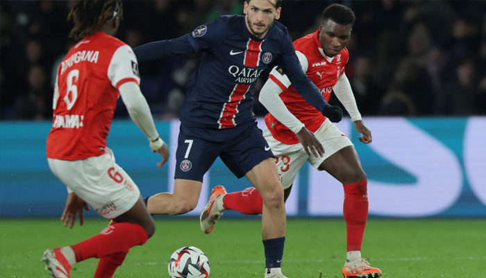 Khvicha Kvaratskhelia (centre) made his PSG debut against Reims on Saturday. — AFP/File