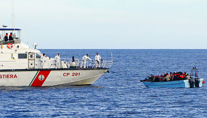 The handout image released by the German NGO Sea Punks shows an Italian Coast Guard vessel conducts a rescue operation as they tow a boat carrying migrants in the Mediterranean Sea on January 26, 2025. —Sea Punks website